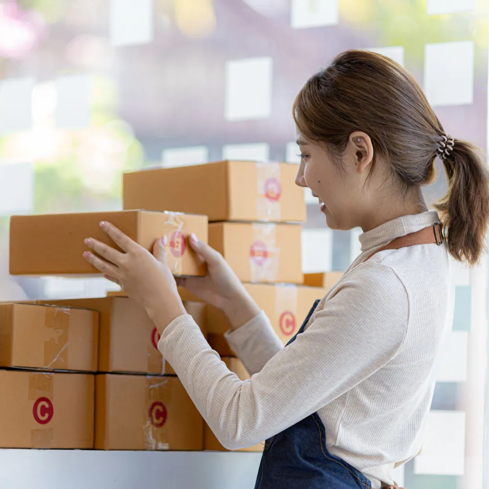 owner-online-store-is-checking-orders-packaged-products-order-prepare-them-delivery-customers-as-ordered-through-website-online-selling-online-shopping-concepts-SQ